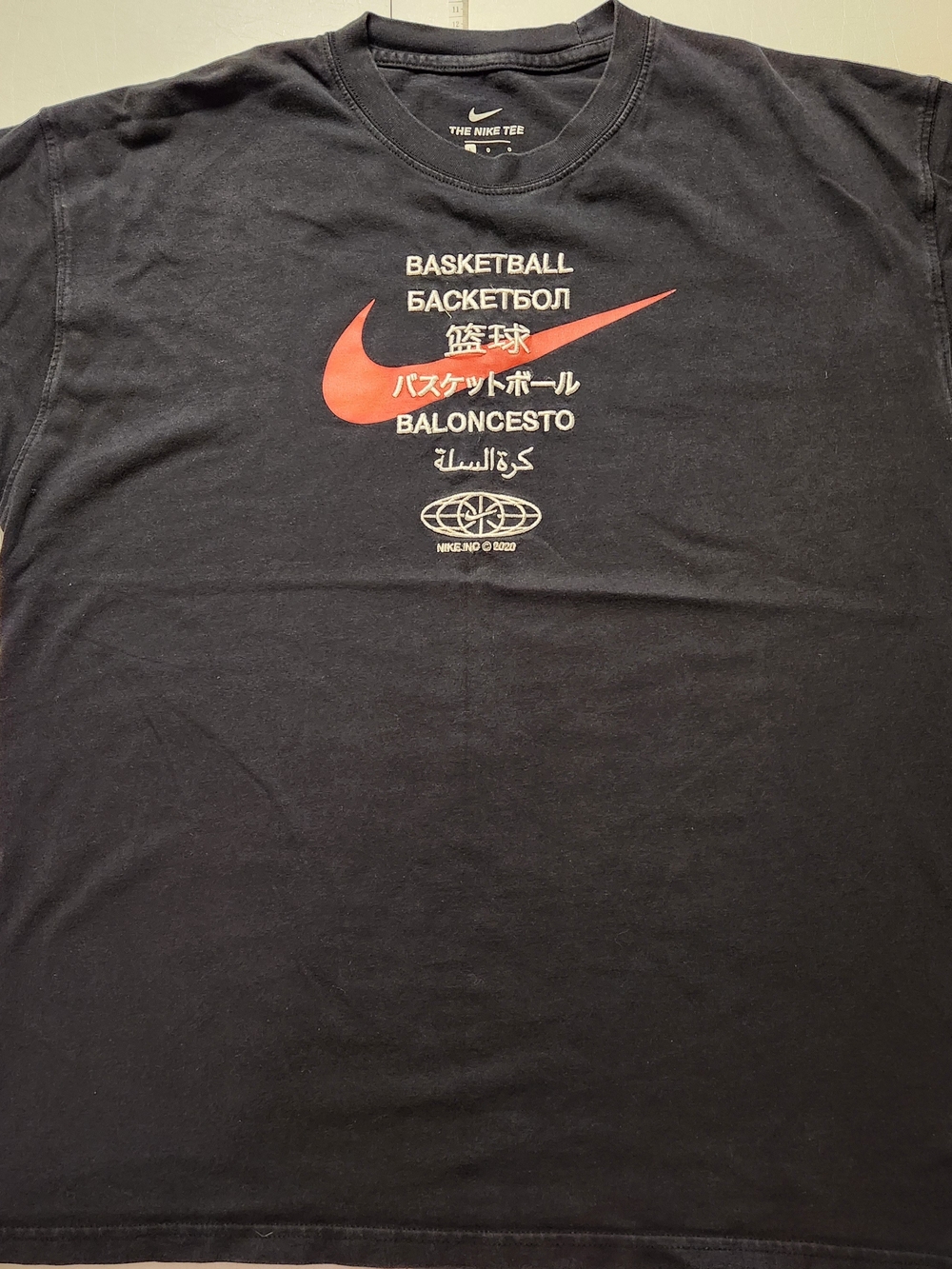 Nike Black Short-Sleeve Basketball Graphic Tee with Red Swoosh